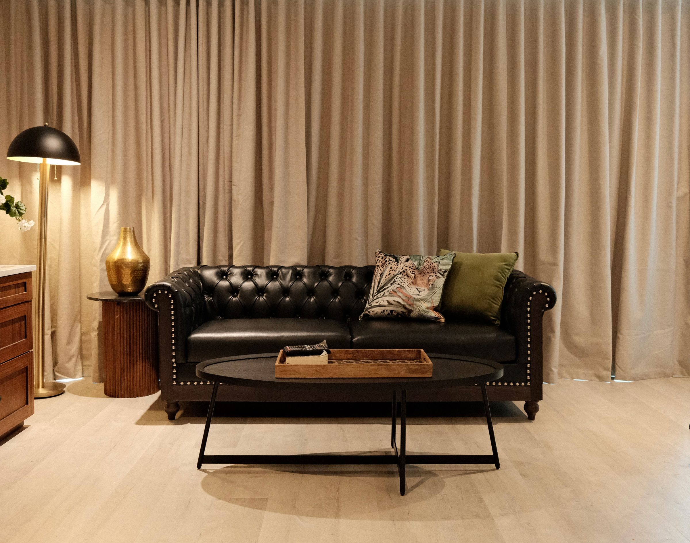 Tufted Chesterfield Lounge - Handcrafted deep-buttoned leather sofa pairing vintage charm with bespoke comfort. | Sterling Suites Ybor City Tampa