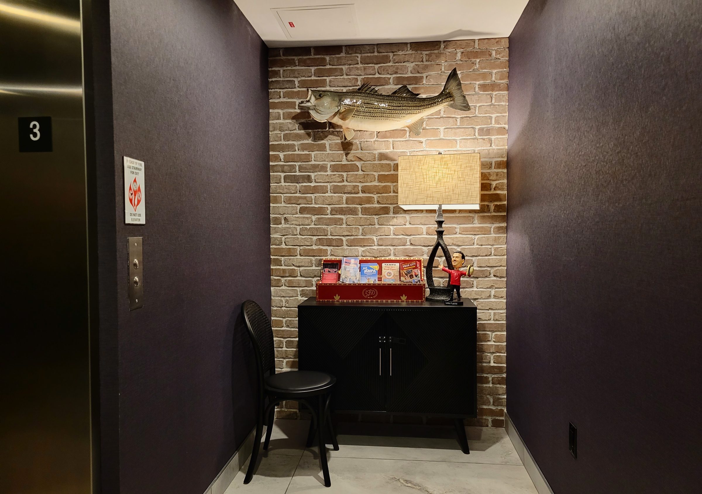 Third Floor Guest Landing - Architectural details in the upper-level guest access breezeway. | Sterling Suites Ybor City Tampa