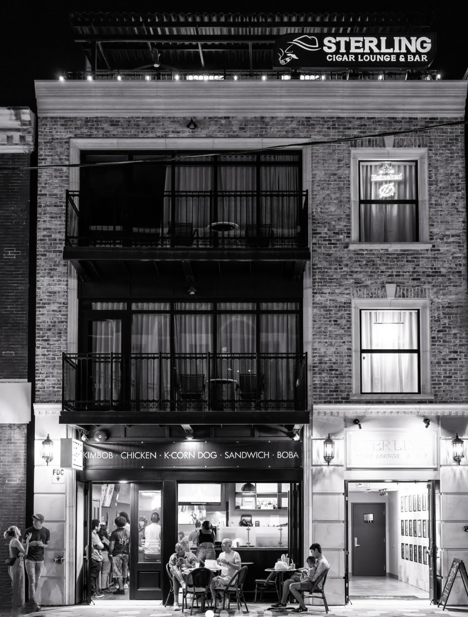 Sterling on 7th at Night - Historic 7th Avenue streetscape showcasing Sterling Suites in the evening twilight. | Sterling Suites Ybor City Tampa